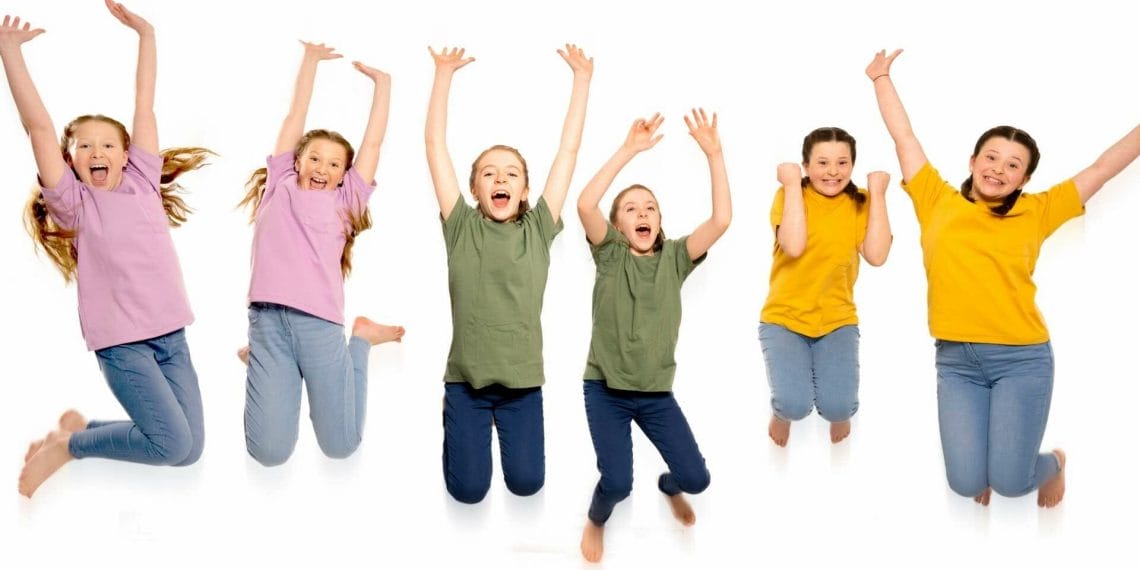Identical JUMPING FOR JOY Emme Eden Patrick age from Waltham Abbey in lavender Kyla Nicole Fox age from County Armagh Northern Ireland in green and Sienna Savannah Robinson age from B