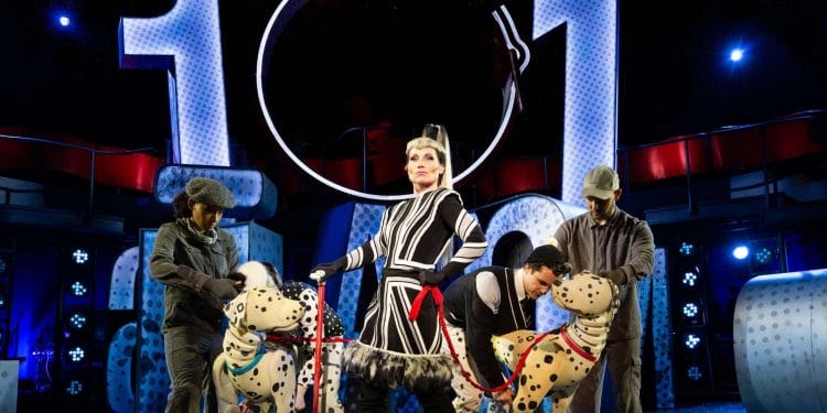 Kate Fleetwood as Cruella de Vil with Pongo and Perdi puppeteed by Yana Penrose Emma Lucia Danny Collins and Ben Thompson. Photo Mark Senior