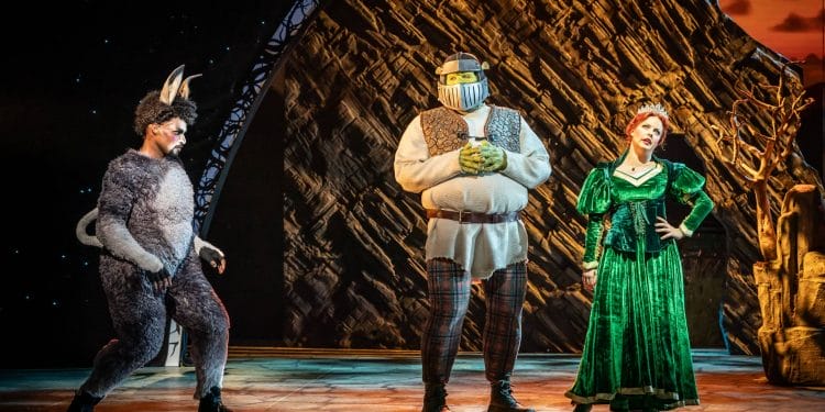 Brandon Lee Sears (Donkey), Antony Lawrence (Shrek) and Joanne Clifton (Fiona) in Shrek the Musical UK and Ireland Tour 2023 4 Photography Credit Marc Brenner